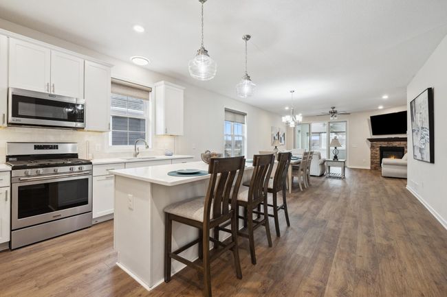 Open concept kitchen with a spacious island. | Image 4