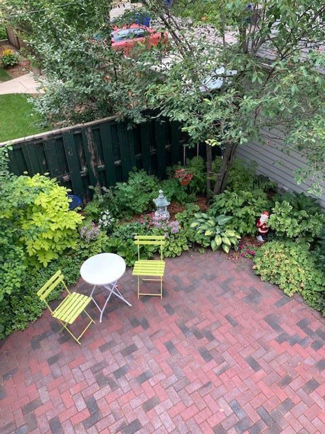 A view of the brick courtyard in summer, showcasing the lovely landscaping. | Image 27