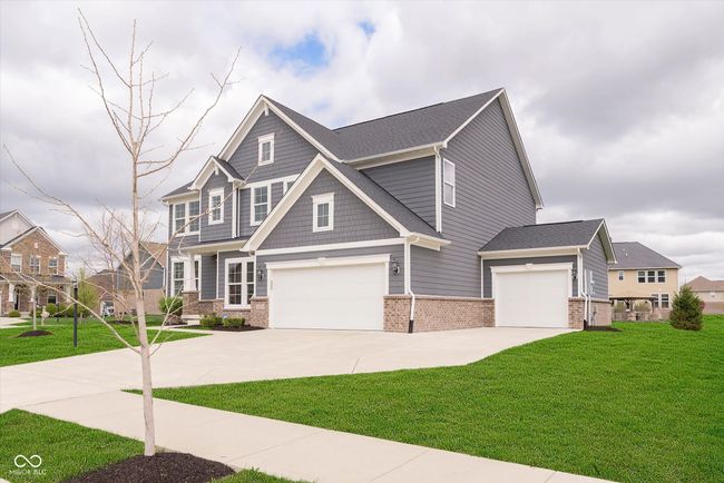 The garage space is quite large! Not only does Horse Branch offer a 3 car garage but it is also large enough for a work space too! | Image 11