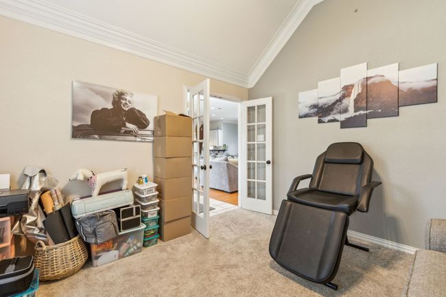 Office featuring lofted ceiling, carpet flooring, french doors, and crown molding | Image 15