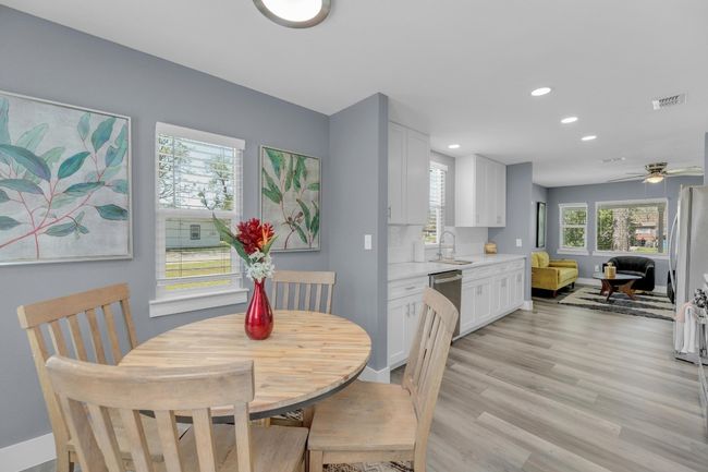 Dining space with recessed lighting, baseboards, light wood finished floors, visible vents, and a ceiling fan | Image 17