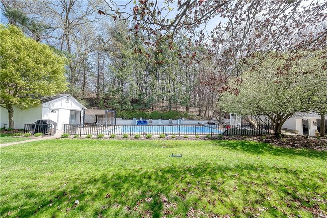 Heated in ground pool and pool house. | Image 37