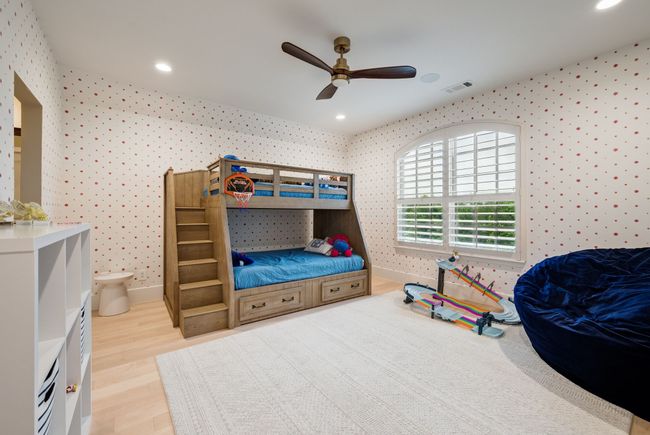 Bedroom featuring wallpapered walls, baseboards, wood finished floors, recessed lighting, and a ceiling fan | Image 28