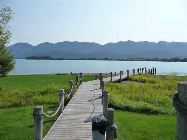 Dock area with a water and mountain view | Image 9