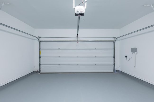 Garage with a garage door opener | Image 32