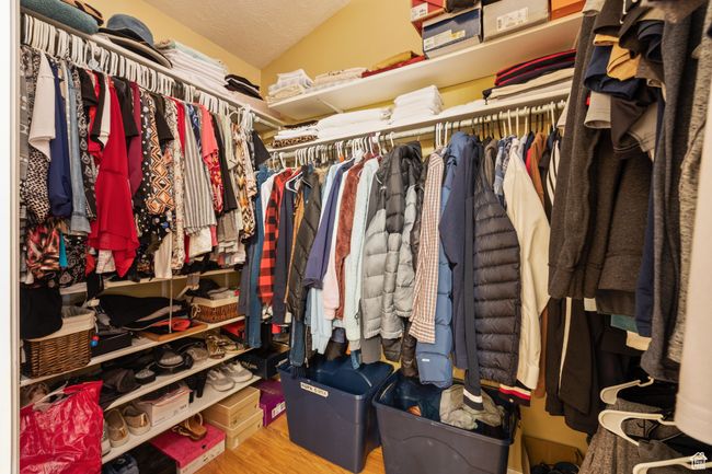 Spacious closet with lofted ceiling and light hardwood / wood-style flooring | Image 21