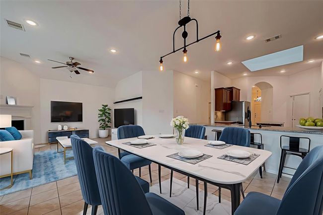 Virtually staged dining and living area | Image 7