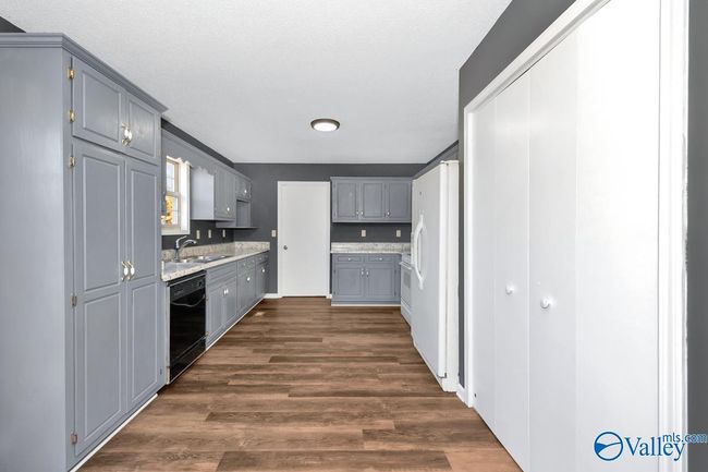 New LVP flooring and paint, wood cabinetry, pantry | Image 22