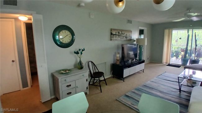 Carpeted living room featuring ceiling fan | Image 12