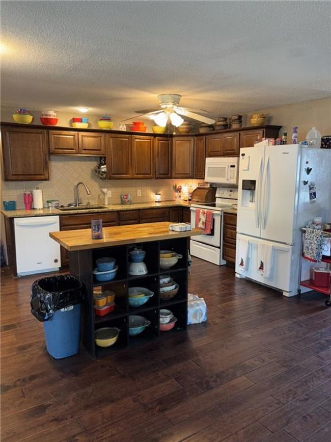 Kitchen featuring island with storage and gorgeous flooring | Image 6