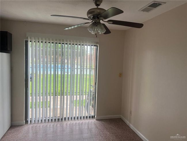 Carpeted spare room with ceiling fan and baseboards | Image 12