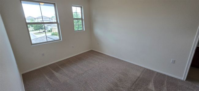 2nd bedroom featuring dark colored carpet | Image 24