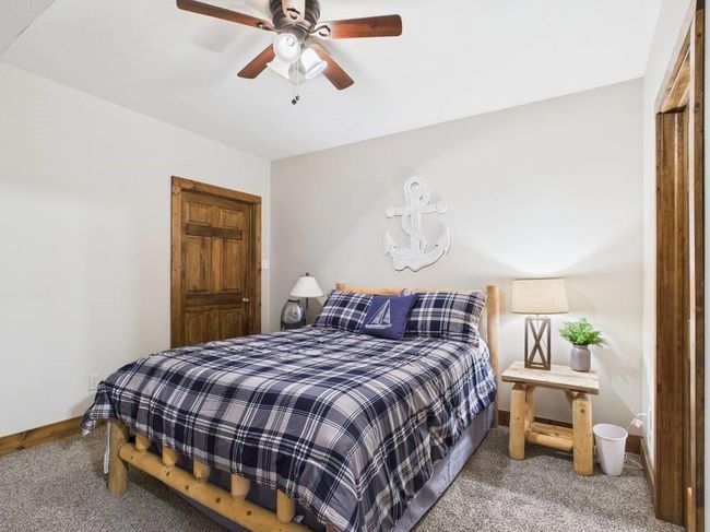 Bedroom 3 with baseboards, carpet flooring, and ceiling fan | Image 59