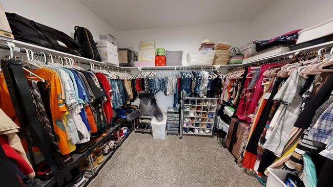 Primary bedroom closet has a lot of space for the king and queen of the home | Image 29