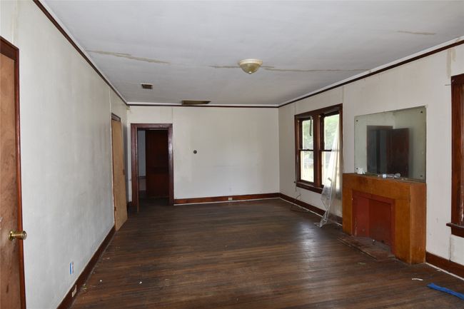 Spare room featuring wood-type flooring and ornamental molding | Image 5