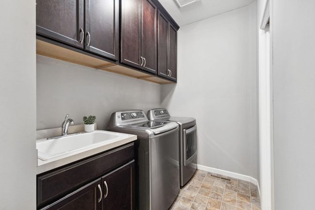 Steps away is your laundry area! | Image 20