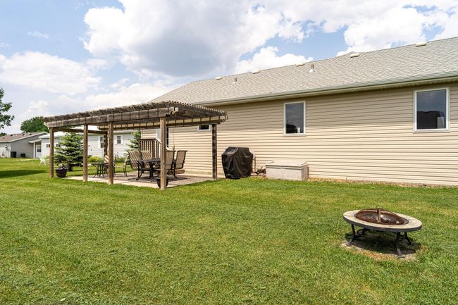 Backyard patio area with pergola | Image 28