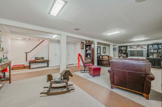 Living room featuring finished concrete floors | Image 20