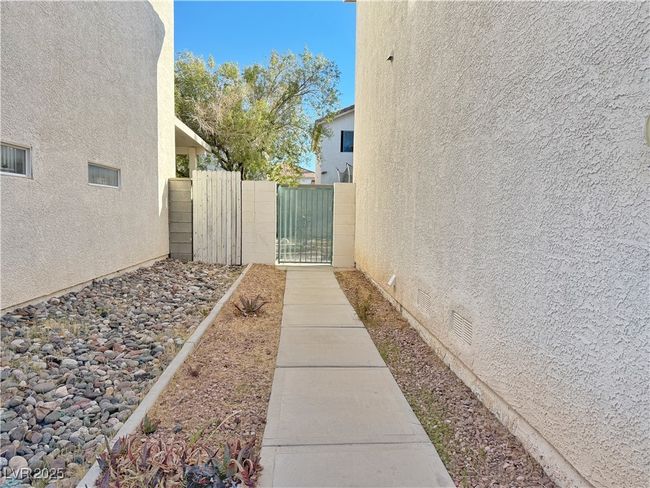 View of yard featuring fence and a gate | Image 46