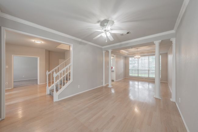 Living room is open to the formal dining room, ideal for entertaining. | Image 10