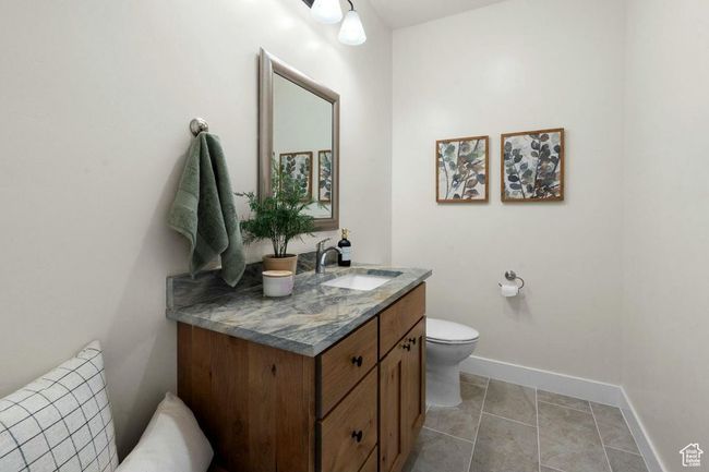 Bathroom with baseboards, toilet, and vanity | Image 21