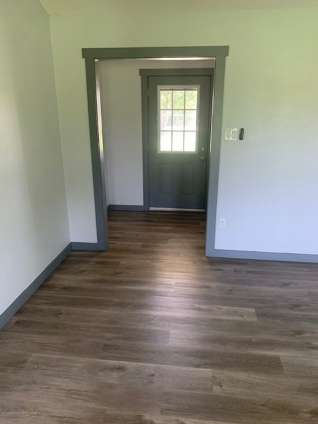 living room and entry door | Image 11