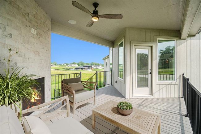 Deck with ceiling fan and a lawn | Image 61