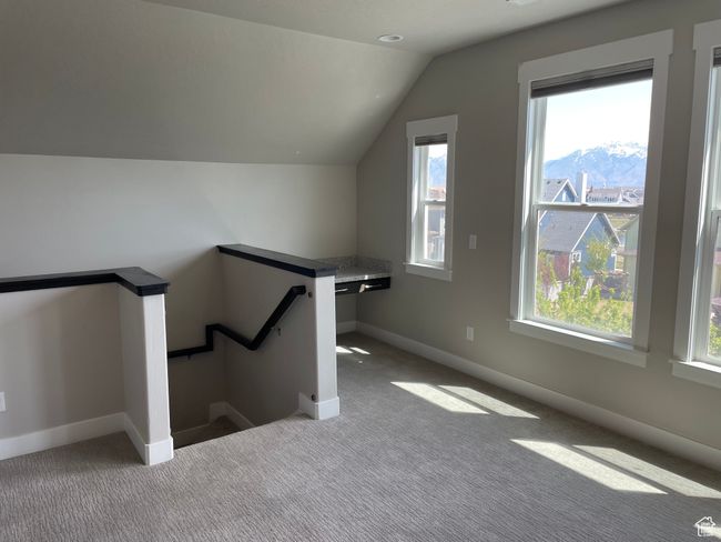 Bonus room with carpet flooring, and a healthy amount of sunlight | Image 52