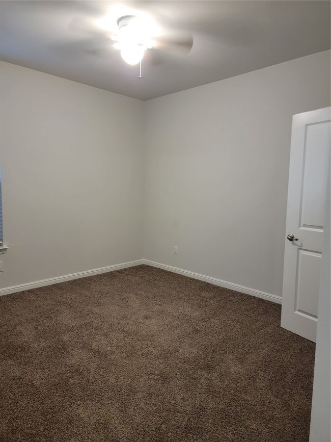 Carpeted spare room featuring baseboards | Image 19