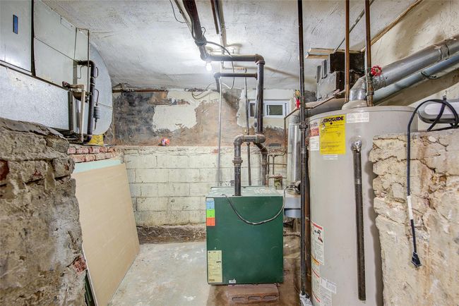 Utilities featuring water heater and a heating unit | Image 14