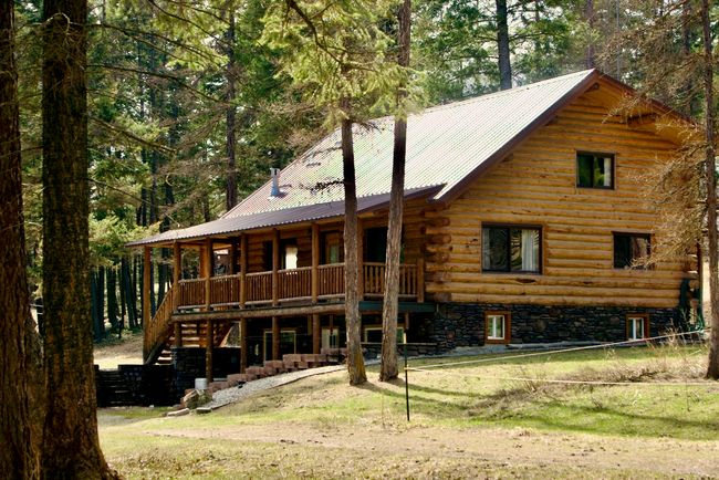 side of house with a lawn, metal roof | Image 56