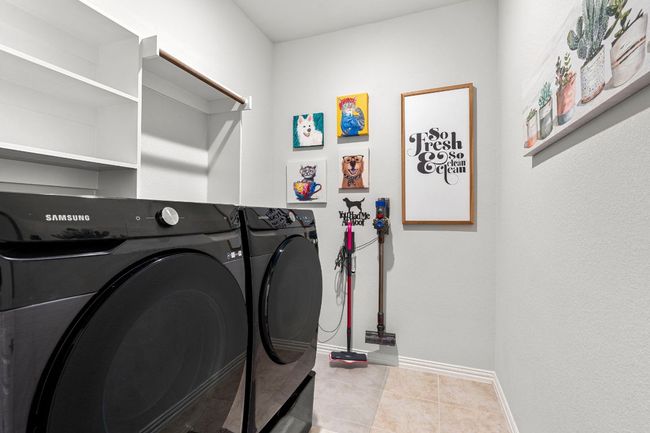 Spacious laundry room with storage space. | Image 15