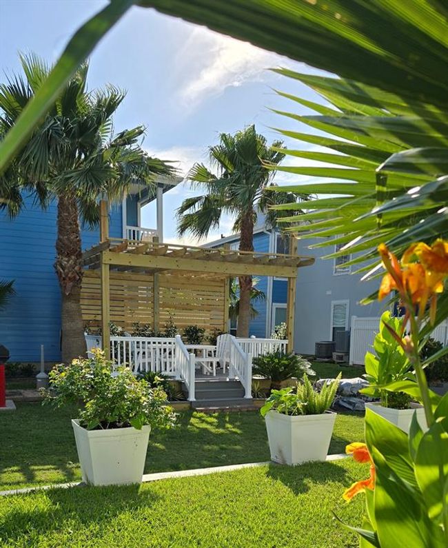 Enjoy outdoor grilling at the community gazebo, surrounded by lush tropical plants and the enchanting scent of jasmine in the air. | Image 11