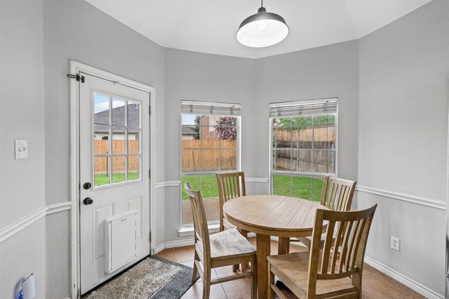 Breakfast nook located off side of kitchen near the back patio. | Image 16