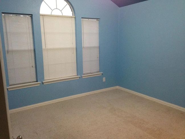 Carpeted spare room featuring baseboards | Image 13