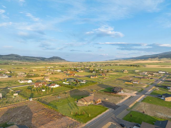 Aerial view of property's location with a mountainous background | Image 36
