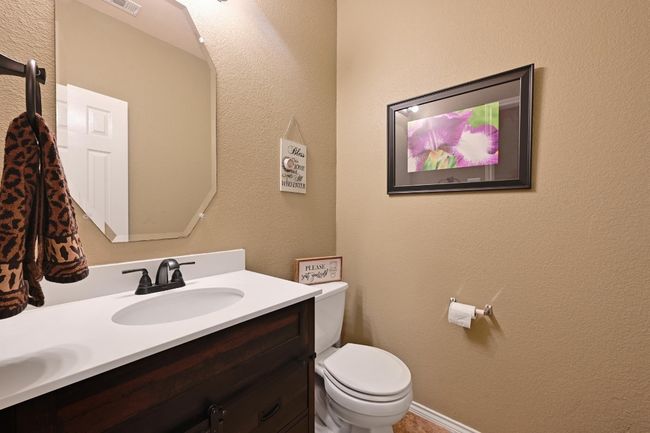 The half bath/powder room is located on the main level and is great for guests. | Image 11