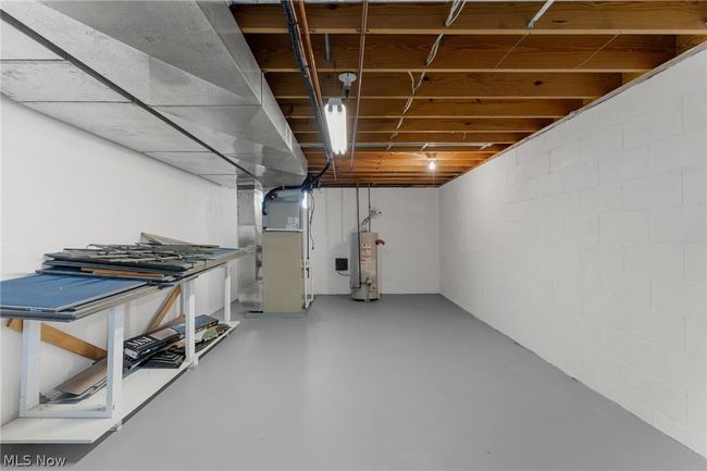 Basement with heating utilities and water heater | Image 24