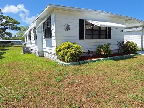 311 Egret Cir, Barefoot Bay, FL, 32976-7812 | Card Image