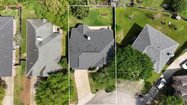 An overhead aerial view highlights the lot size, offering a clear perspective of the spacious property and its well-maintained surroundings. | Image 37