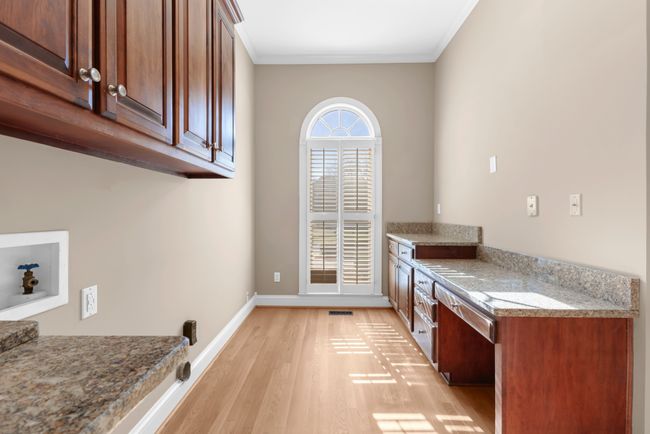 laundry room with granite counters | Image 30