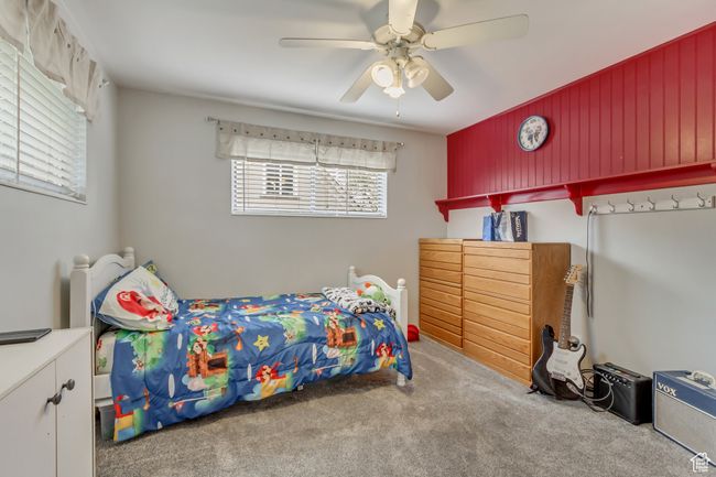 Bedroom with carpet floors and a ceiling fan | Image 13