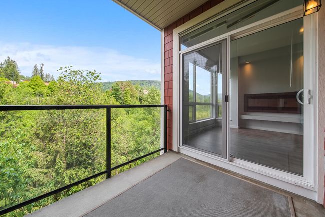 Balcony featuring a forest view | Image 38