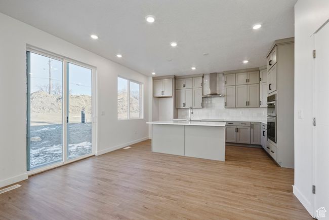 Where memories are made: a bright, open living area that flows right into the kitchen—perfect for laughter, lounging, and late-night snacks. | Image 6