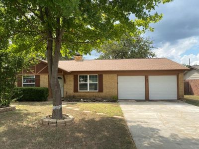 Single story home featuring a garage | Image 1