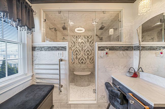 Bathroom featuring vanity, a stall shower, and tile walls | Image 17