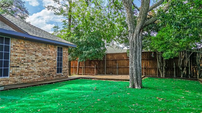Fenced backyard featuring a wooden deck | Image 23