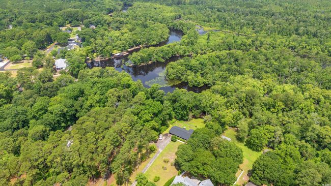 View of property location with a forest and a large body of water | Image 36
