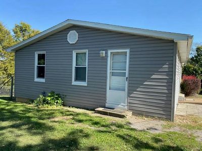 Rear view of house with a lawn | Image 2