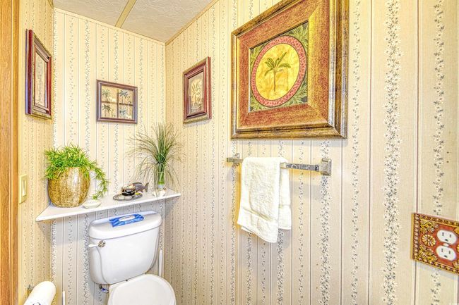 Bathroom with toilet and a textured ceiling | Image 22